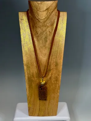 CARVED JADE PENDANT WITH BRASS AND DEER SUED NECKLACE LCN605
