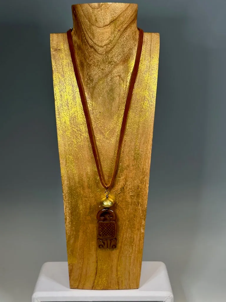 CARVED JADE PENDANT WITH BRASS AND DEER SUED NECKLACE LCN605