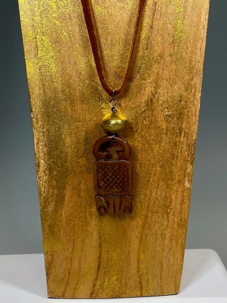 CARVED JADE PENDANT WITH BRASS AND DEER SUED NECKLACE LCN605