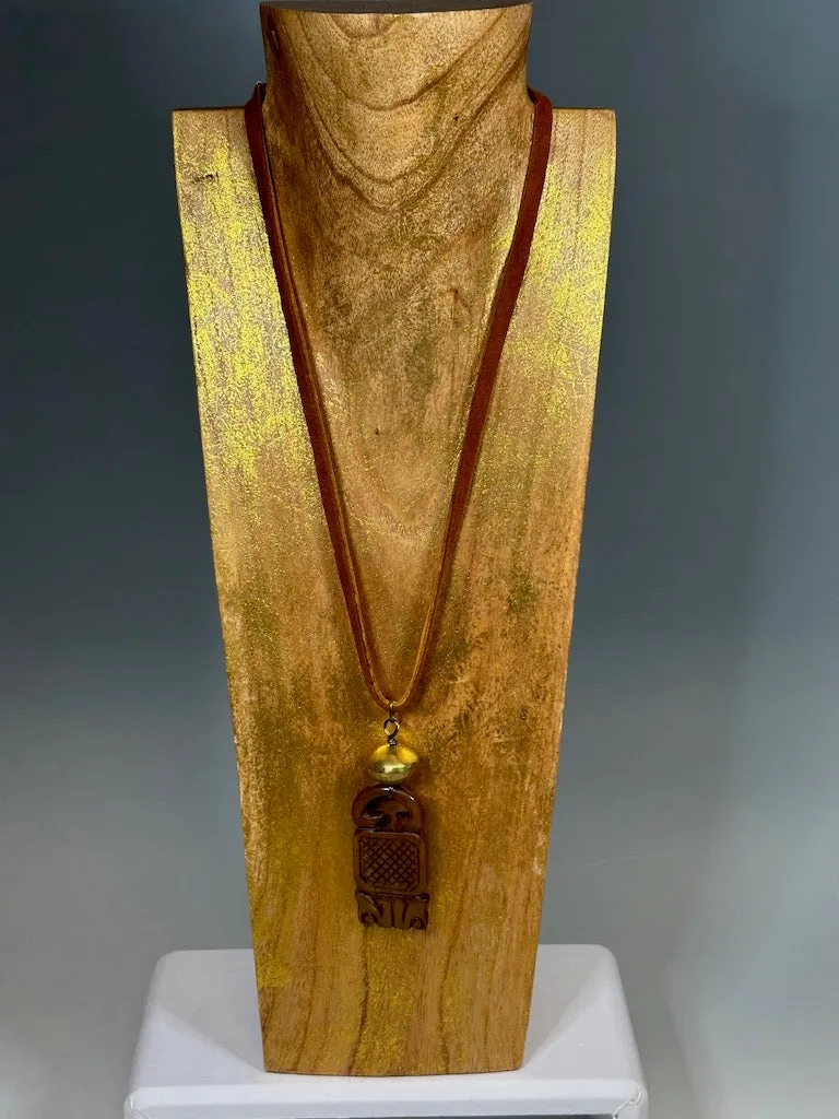 CARVED JADE PENDANT WITH BRASS AND DEER SUED NECKLACE LCN605