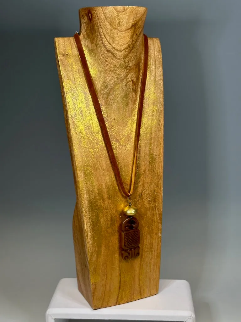 CARVED JADE PENDANT WITH BRASS AND DEER SUED NECKLACE LCN605