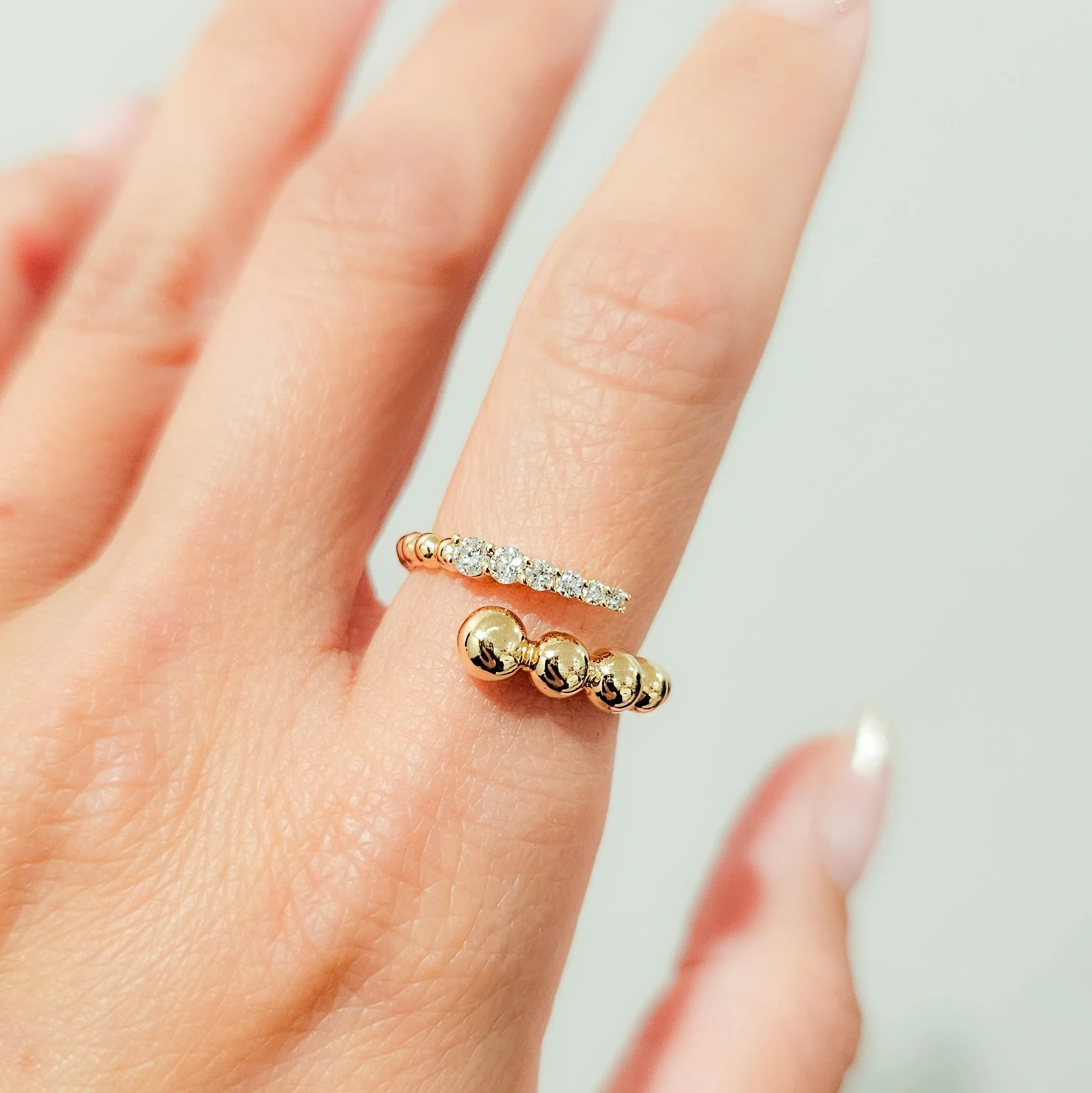Graduated beaded open diamond ring