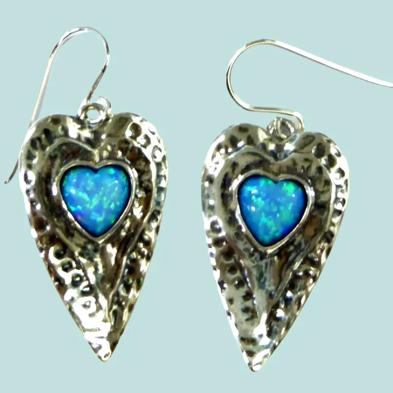 Sterling silver heart earrings set with blue opals.